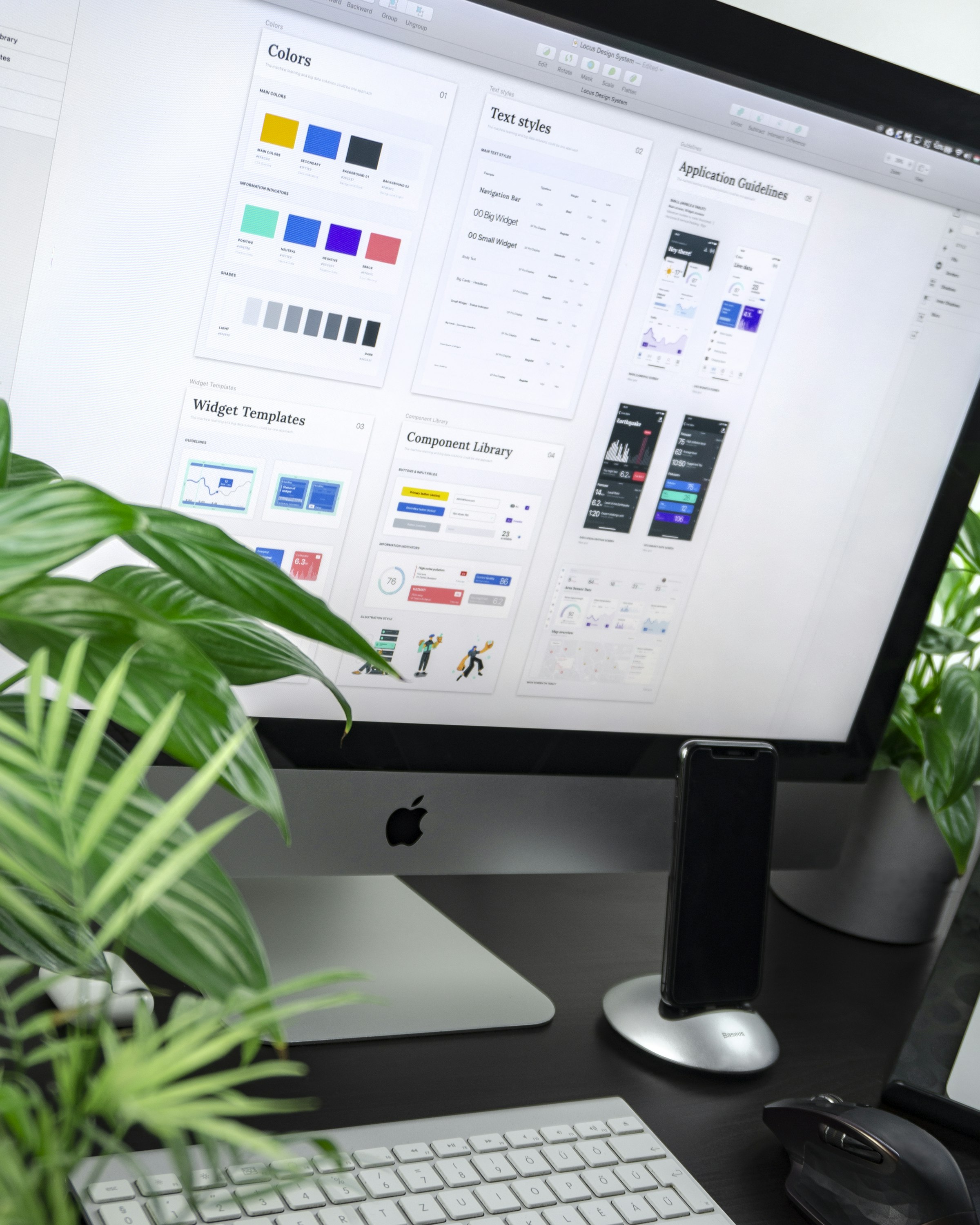 Brand design system and visual identity work on a studio desk