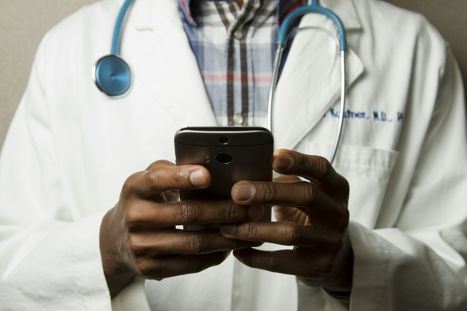 Healthcare professional managing digital channels on a smartphone
